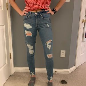 mid rise medium wash ripped ankle leggings